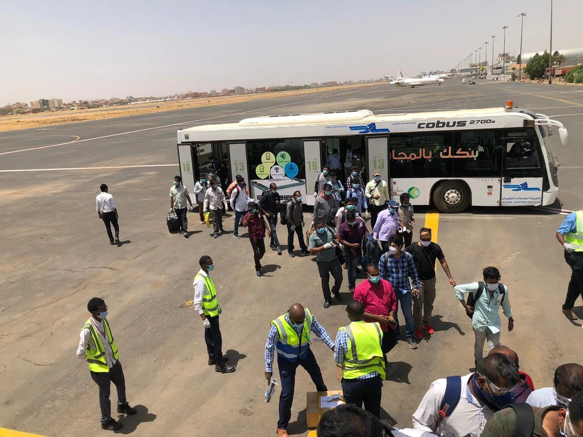 Indian nationals on their way to the repatriation flight. (SUNA)