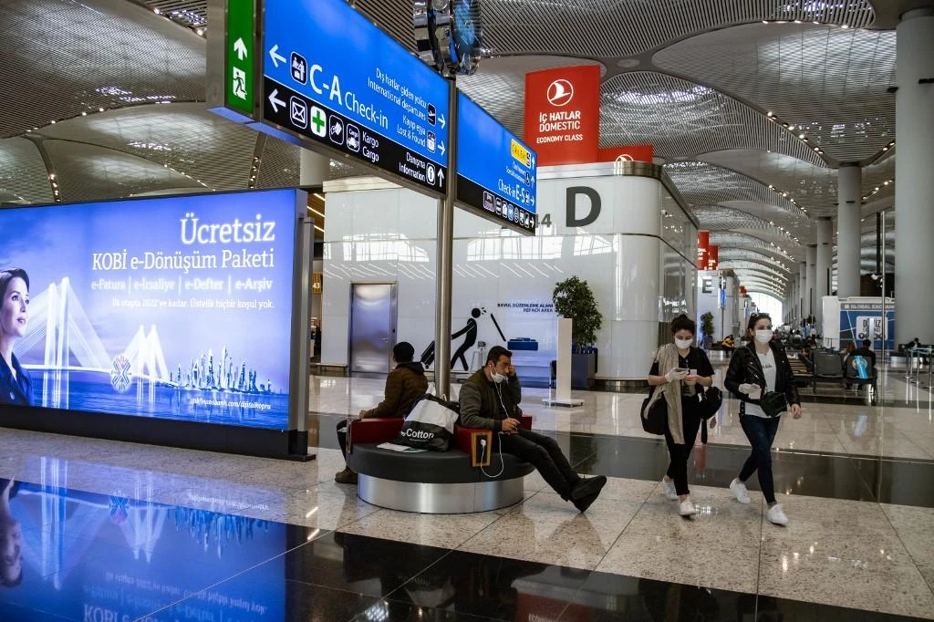 Passengers wait for flights at the Istanbul Airport on the first day of the resumption of domestic flights in Istanbul on June 1, 2020. (AFP)