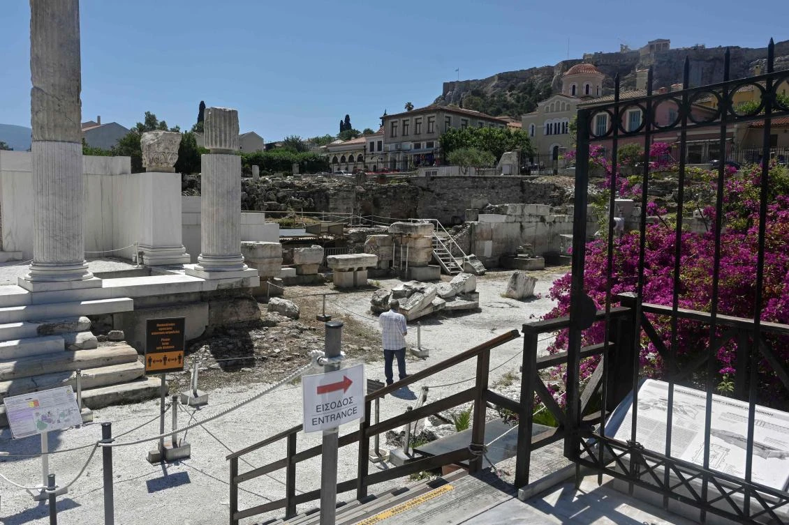 A tourist walks at the archaeological site of Hadrian’s library in Athens on June 4, 2020. (AFP)