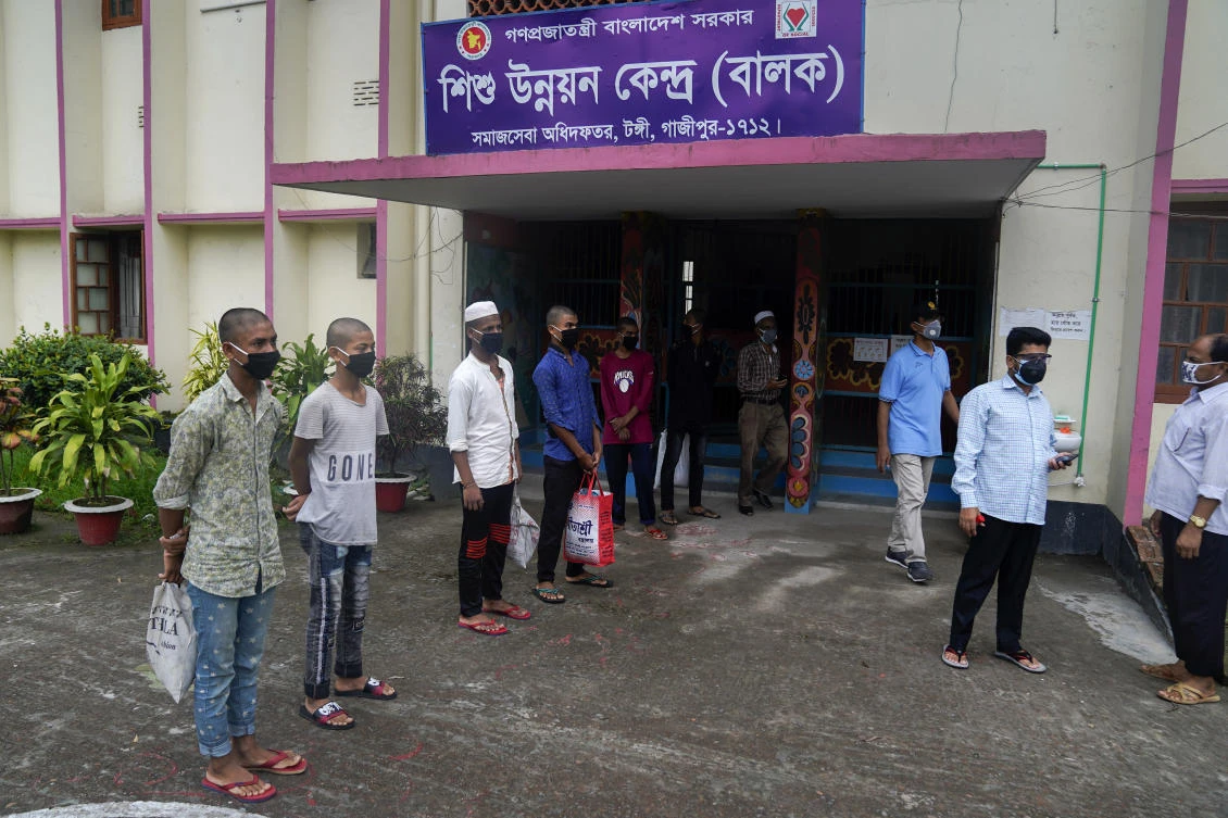 Mohammed Rakib, 15, who was accused of beating a man and sent to a detention center, stands with other inmates before being released in Tongi, Bangladesh. (UNICEF via AP)