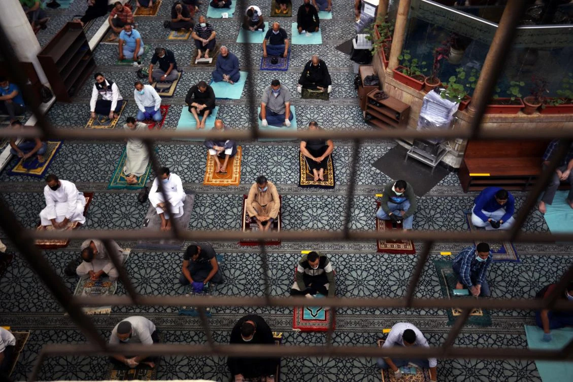 Muslims attend Friday prayers at al Husseini mosque for the first time after the closure of places of worship in Jordan for more than two months amid concerns over the spread of the coronavirus disease (COVID-19), in downtown Amman. (Reuters)