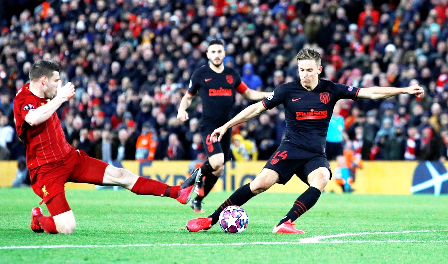 Atletico Madrid’s Marcos Llorente scores a goal against Liverpool during their match in London. The Reds will play against Everton on June 21. (Reuters/File)