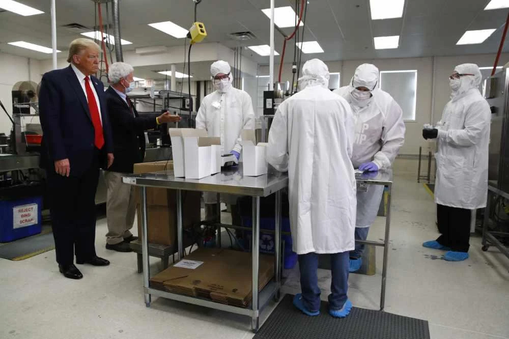 President Donald Trump tours Puritan Medical Products medical swab manufacturing facility on June 5, 2020, in Guilford, Maine. (AP Photo/Patrick Semansky)