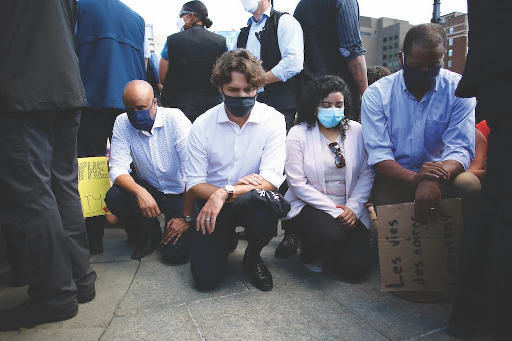 Canadian Prime Minister Justin Trudeau (2nd L) takes a knee during in a Black Lives Matter protest on Parliament Hill June 5, 2020 in Ottawa, Canada. (AFP)