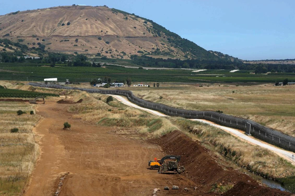 This picture taken from the Israeli-annexed Golan Heights on June 5, 2020 shows the border fence with the south-western Syrian governorate of Quneitra. (AFP)