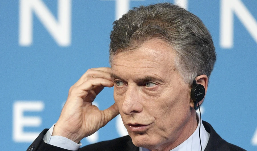 In this file photo taken on December 01, 2018, Argentina's President Mauricio Macri listens to a journalist's question during the final press conference, on the second day of the G20 Leader's Summit, in Buenos Aires. (AFP)