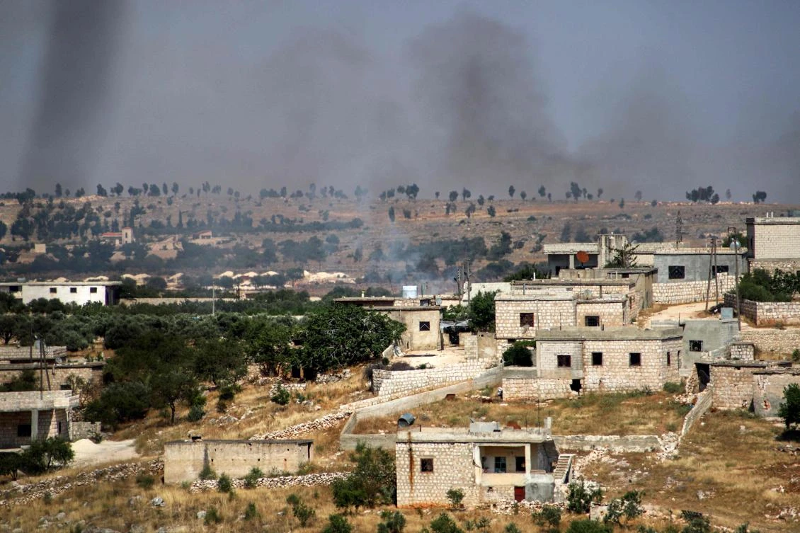 This picture taken on June 4, 2020 shows smoke plumes rising following shelling by pro-Syrian government forces in the town of Banin, north of Maaret al-Numan in Syria's northwestern Idlib province. (AFP)