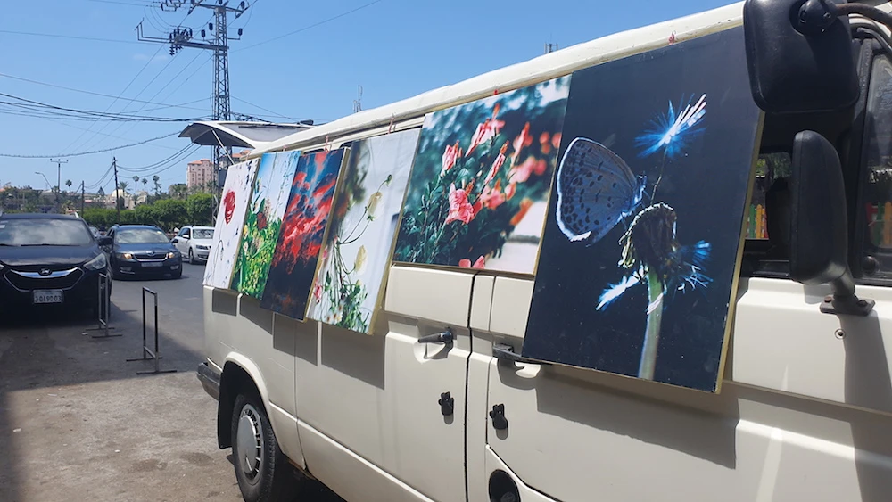 Ammar Abu Shamala and his wife Arwa tour the streets, squares, and main markets in the Gaza Strip with their mobile art exhibition. (AN Photo)