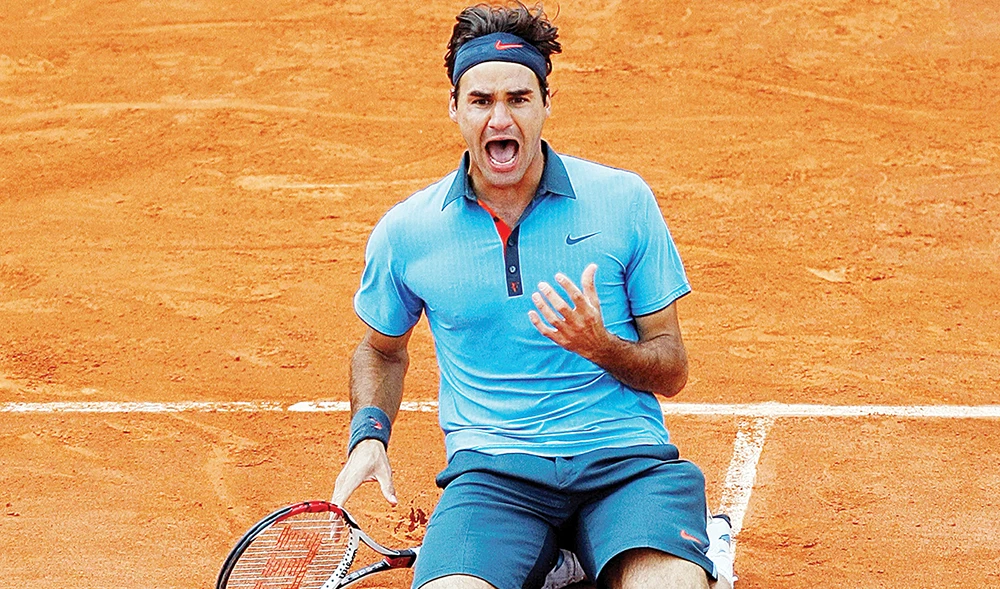 Federer after winning his maiden French Open title in June 2009, beating Swede Robin Soderling in the final. (File/Reuters)
