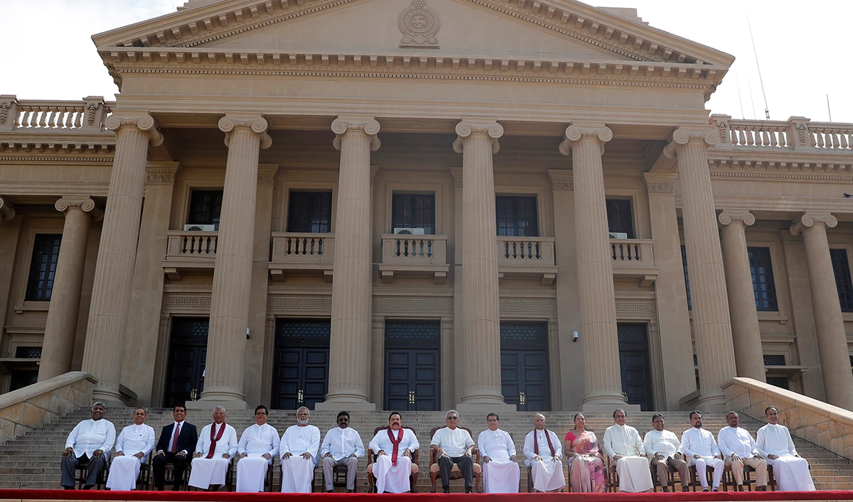 Sri Lankan President Gotabaya Rajapaksa, seated center, with his new Cabinet members in this Nov. 22, 2019 photo in Colombo. Aug. 5 is the new date for elections. (AP)