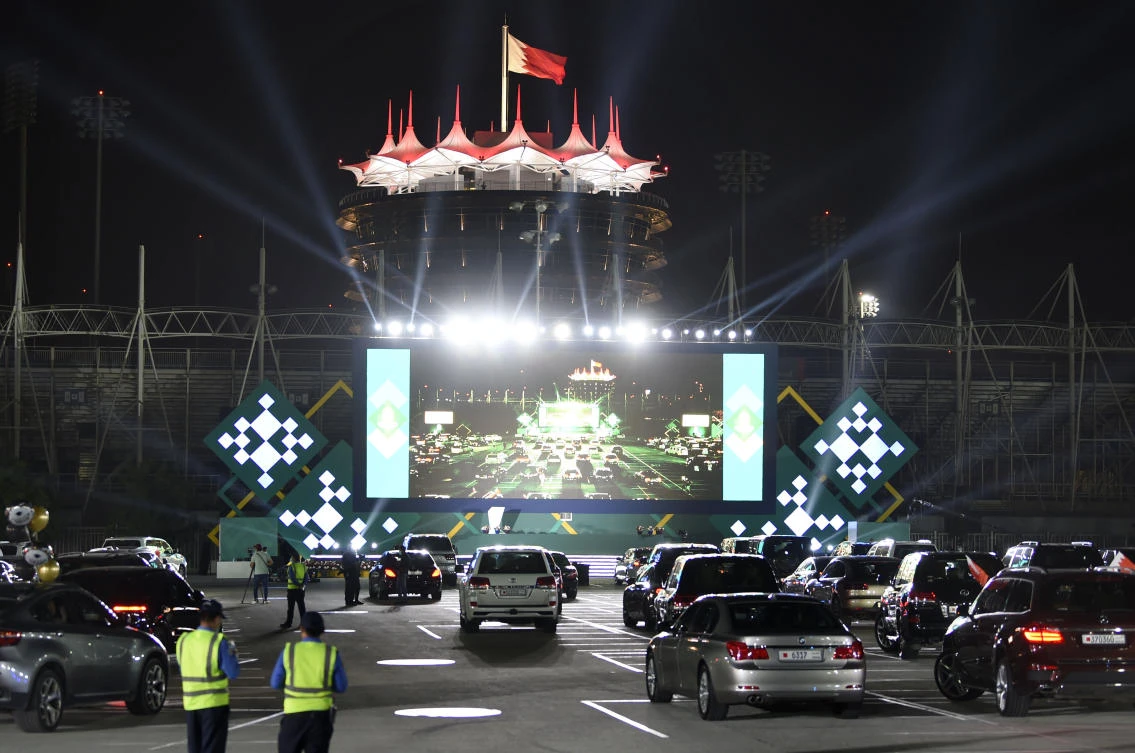 Graduates of Bahrain Bayan School receive their diplomas at Bahrain International Circuit (BIC) in Sakhir race track on June 10, 2020 south of Bahraini capital Manama. (AFP)
