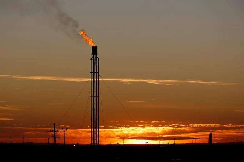 A flare burns excess natural gas in the Permian Basin, in Loving County, Texas, US, November 23, 2019. (Reuters)