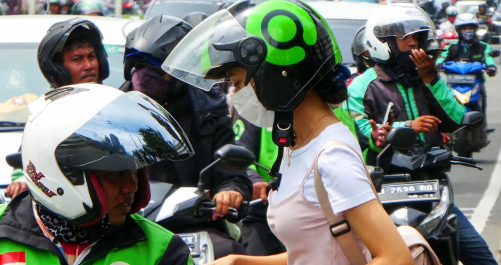 Drivers waiting for work in Jakarta, Indonesia. Demand is down in Southeast Asia’s largest economy due to lockdown restrictions. (AFP)