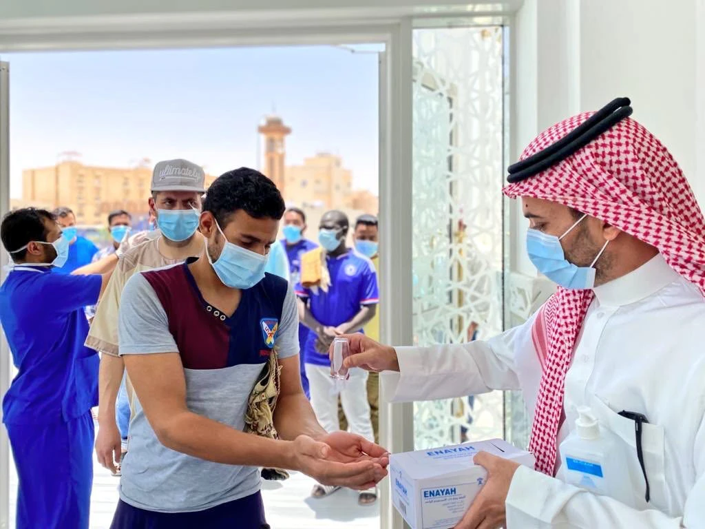 Volunteers with the Ministry of Health stand ready to assist mosque visitors nationwide with masks and hand sanitizer. (Twitter photo)
