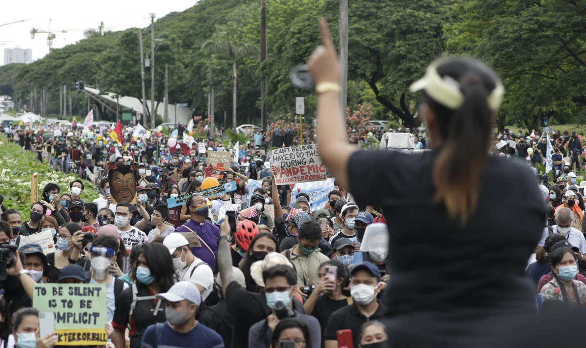 A protester gestures as she talks to the crowd during an anti-terror bill rally at the University of the Philippines in Manila, Philippines as they observe Philippine Independence Day on Friday, June 12, 2020. (AP)