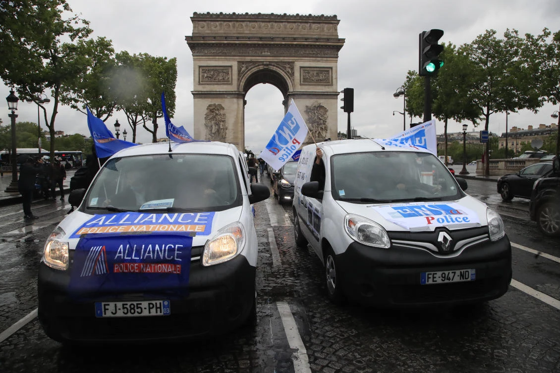 French police unionists demonstrate on the Champs-Elysee din front of the Arc de Triomphe, Friday, June 12, 2020 in Paris. French police are protesting a new ban on chokeholds and limits to what they can do during arrests, part of government efforts to stem police brutality and racism in the wake of global protests over George Floyd's death in the U.S. (AP)