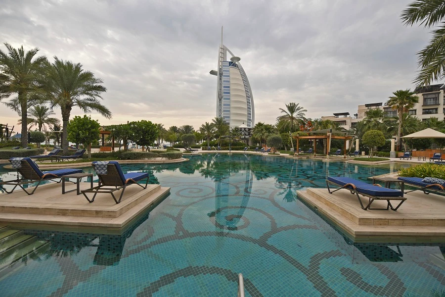 This picture taken on May 20, 2020 shows a view of the Burj Al Arab hotel in Dubai as seen from the swimming pool of the Jumeirah al-Naseem hotel, as beaches open while coronavirus pandemic lockdown measures are eased in the Gulf emirate. (File/AFP)