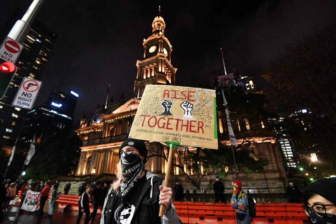 The Sydney rallies attended by thousands, and dominated by a heavy police presence, were mostly peaceful. (AFP)