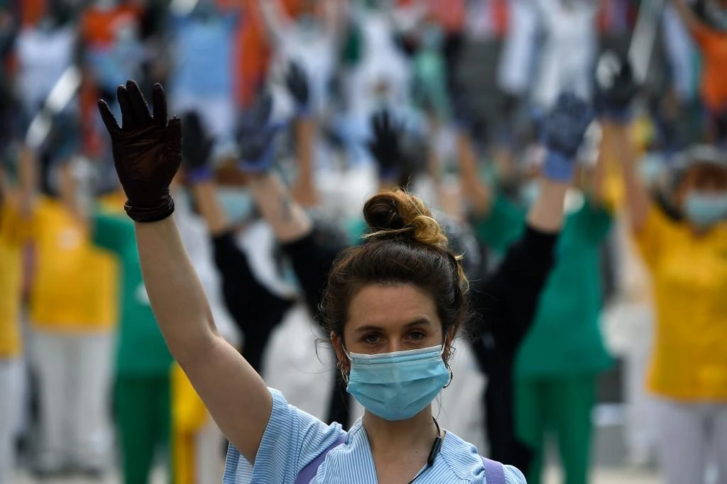A healthcare worker takes part in a protest calling for a reinforced healthcare system outside the Gregorio Maranon hospital in Madrid on June 8, 2020. (AFP)