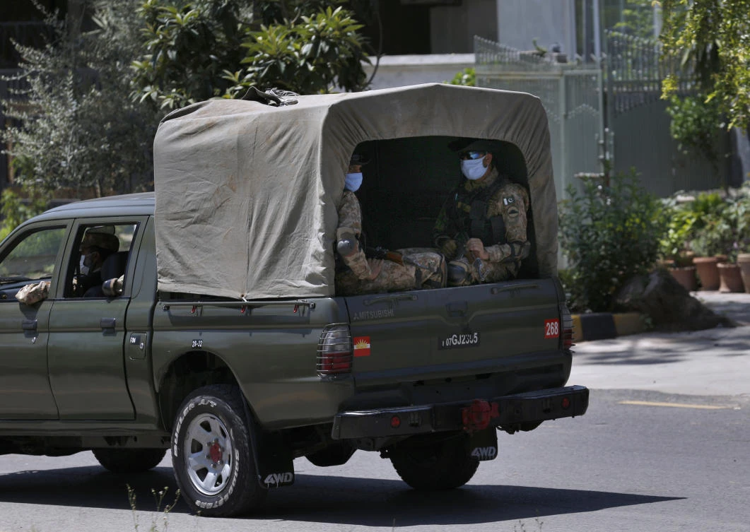 Pakistan army troops patrol in a restricted area to help to contain the spread of new coronavirus, in Islamabad, Pakistan, Saturday, June 13, 2020. (AP)