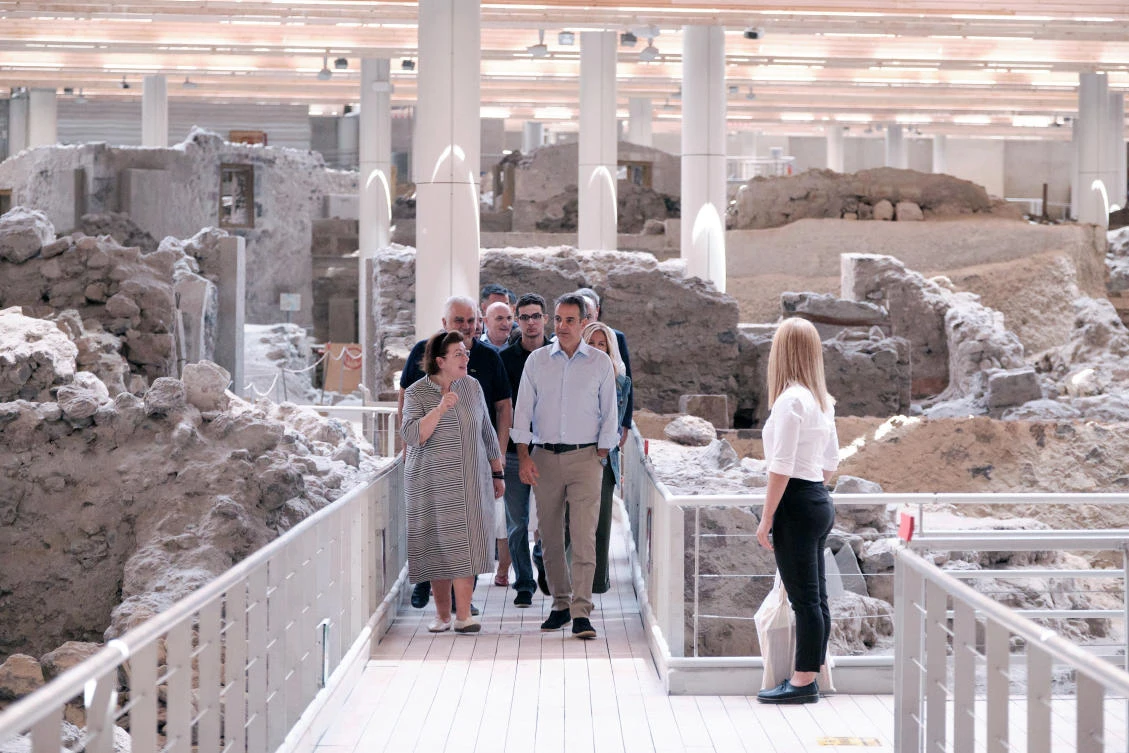 Greek Culture Minister Lina Mendoni, left, and Greek Prime Minister Kyriakos Mitsotakis during their visit to the archaeological site of Akrotiri on Santorini, Saturday, June 13, 2020. (AP Photo)
