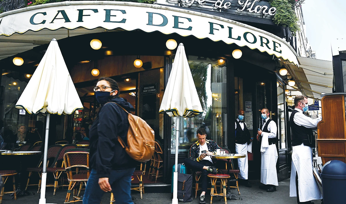 Paris is rediscovering itself, as its cafes and restaurants reopen for the first time since the virus forced them to close their doors on March 14. (AFP)