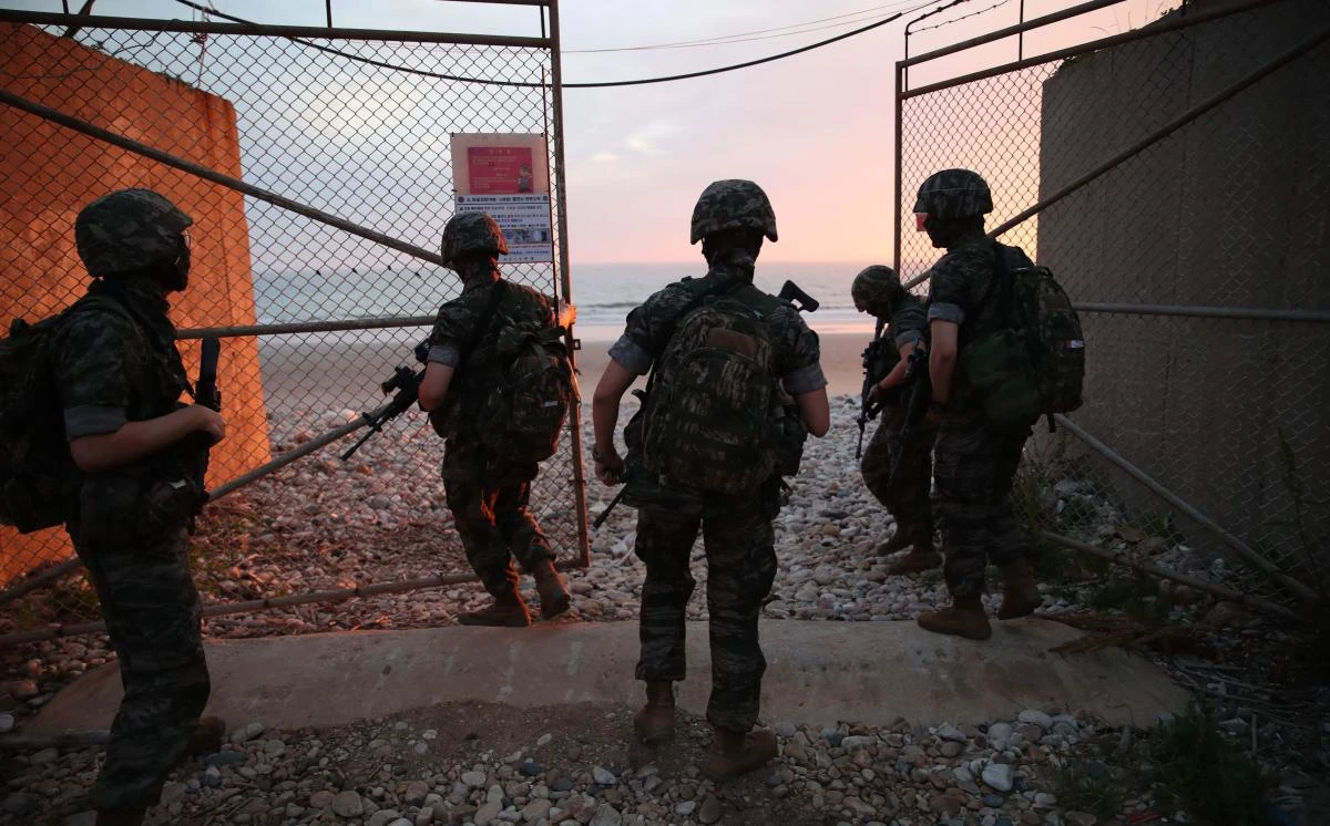 South Korean marines lock the entrance to a beach on the South Korea-controlled island of Yeonpyeong near the 'northern limit line' sea boundary with North Korea on June 16, 2020. North Korea blew up an inter-Korean liaison office on its side of the border on June 16, after days of increasingly virulent rhetoric from Pyongyang. (AFP)
