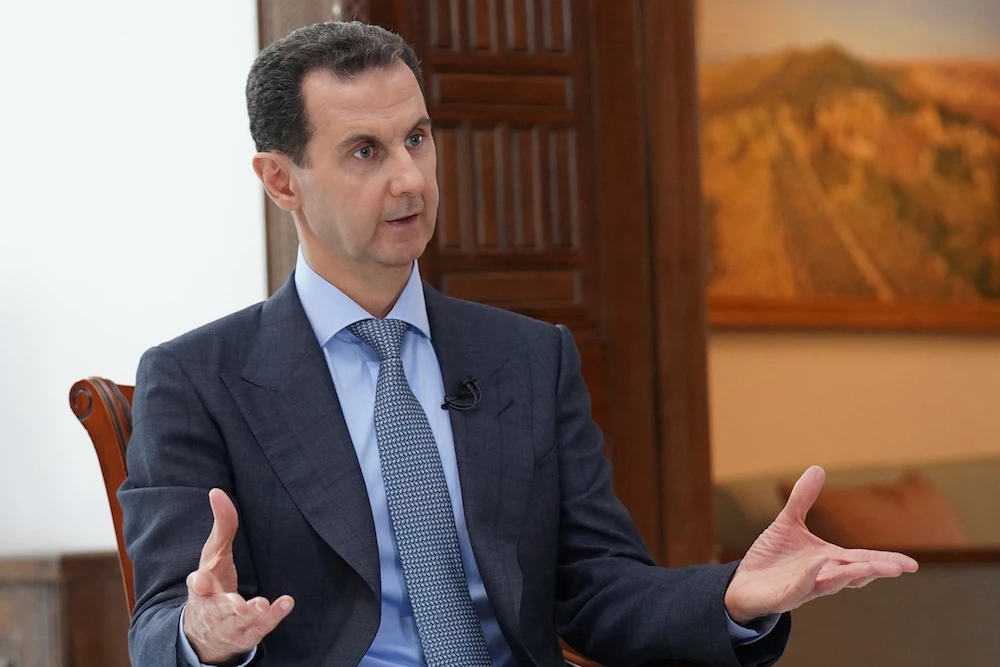 A handout picture released by the official Syrian Arab News Agency (SANA) on March 5, 2020 shows President Bashar Assad speaking during an interview with Russia Today in Damascus. (AFP/HO/SANA)
