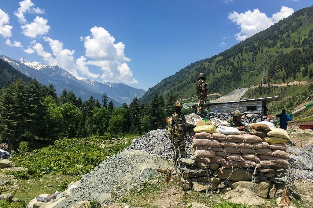 Above, Indian border soldiers guard a highway leading towards Leh, bordering China, in Gagangir on June 17, 2020. (AFP)