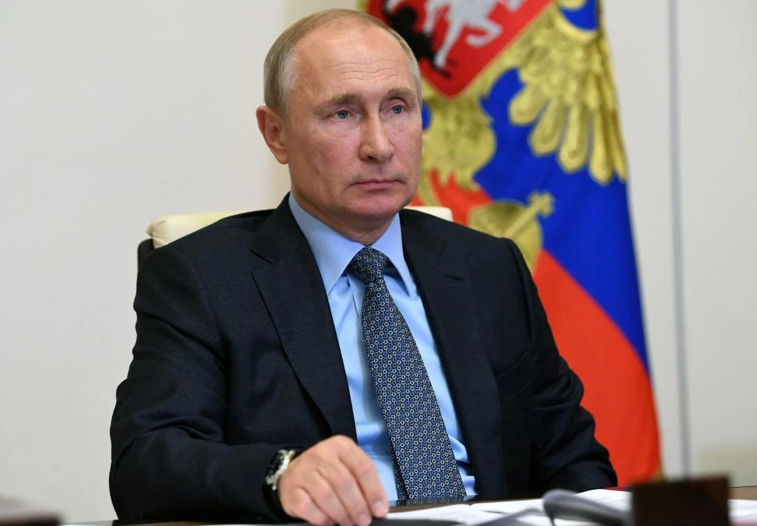Russian President Vladimir Putin attends a meeting via video conference at the Novo-Ogaryovo residence outside Moscow on Monday, June 15, 2020. (Kremlin pool photo via AP)