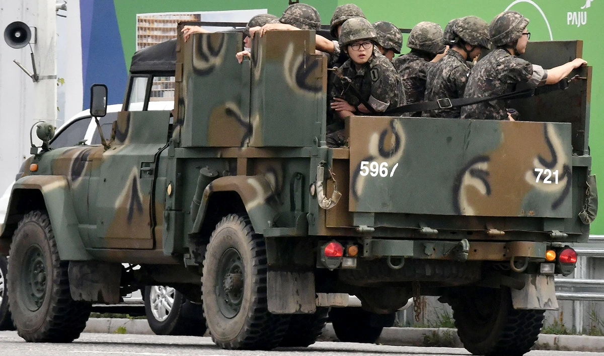 South Korean soldiers ride on the back of a military vehicle in the border city of Paju on June 17, 2020. (AFP)