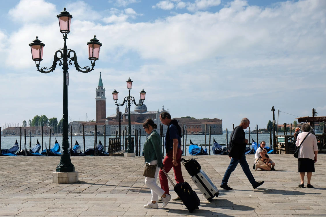 Tourism is one of the engines of Italy’s economy. Above, tourists are seen near St. Mark’s Square in Venice, Italy on June 14, 2020. (Reuters)
