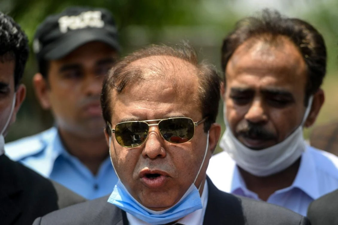 Khawaja Imtiaz (C), a special public prosecutor for the 2010 murder case of influential Pakistani politician Imran Farooq in London, speaks to media representatives outside an Anti-Terrorism Court after a verdict in Islamabad on June 18, 2020. (AFP)