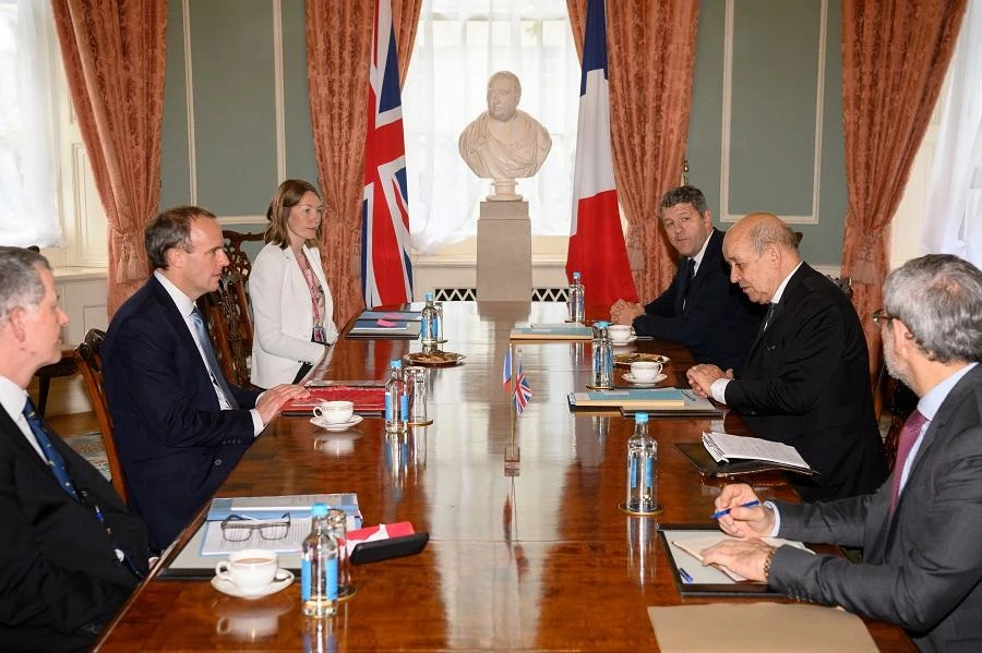 British Foreign Secretary Dominic Raab (C-L) speaks with his French counterpart Jean-Yves Le Drian (C-R) during a meeting in London, England on June 18, 2020 in central London on June 18, 2020 as part of French President Emmanuel Macron's visit to mark the anniversary of former French president Charles de Gaulle's appeal to French people to resist the Nazi occupation. (File/AFP)