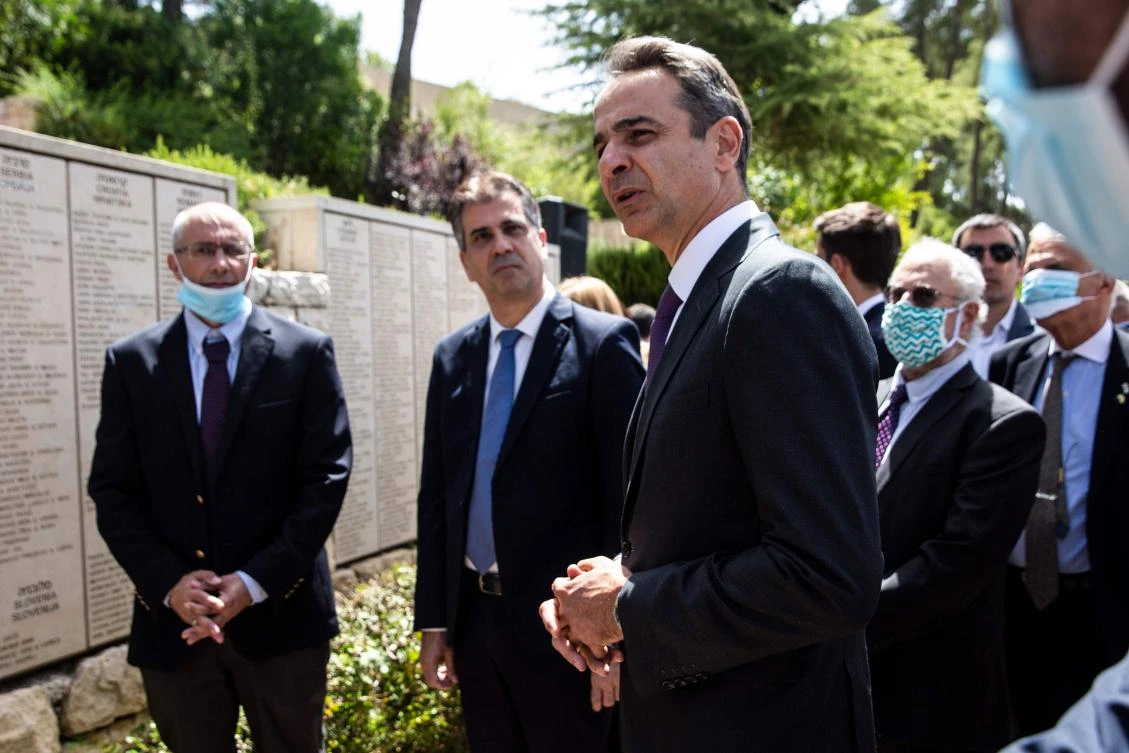Greek Prime Minister Kyriakos Mitsotakis visits the Righteous Among the Nations Memorial on June 17, 2020, during his visit to the Yad Vashem Holocaust Museum in Jerusalem. (AFP)