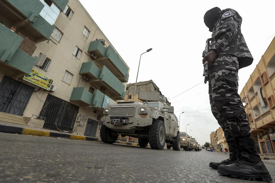 A member of security forces affiliated with the Libyan Government of National Accord (GNA)'s Interior Ministry stands as a security patrol advances in the town of Tarhuna, about 65 kilometres southeast of the capital Tripoli on June 11, 2020. (File/AFP)