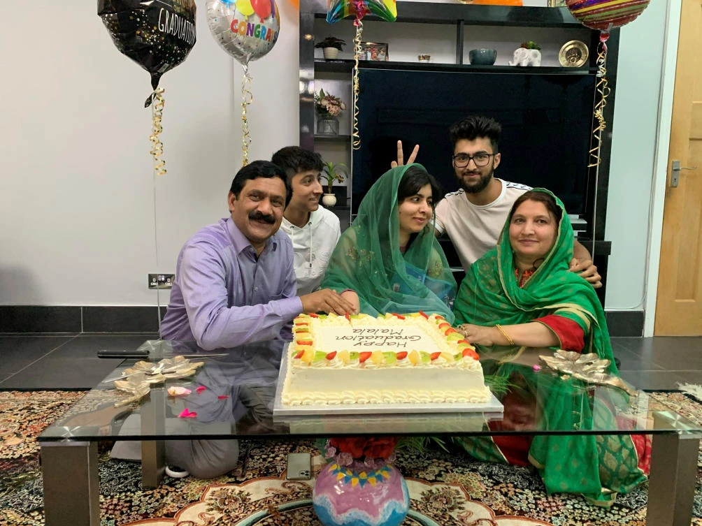 Activist Malala Yousafzai celebrates with family after completing her Philosophy, Politics and Economics degree from Oxford University on June 18, 2020. (Malala Yousafzai/Reuters)