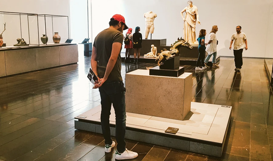 Tourists and visitors view antiques at the Louvre art and civilization museum in Abu Dhabi, the UAE. The COVID-19 crisis is seen as an opportunity within an unfortunate situation to experience new adventures. (Photo/Shutterstock)