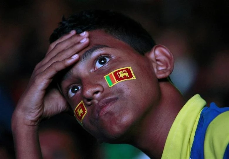 A fan of the Sri Lankan cricket team reacts as he watches the ICC Cricket World Cup final match between Sri Lanka and India on a big screen at Galle Face Green in Colombo April 2, 2011. (REUTERS/ File photo)