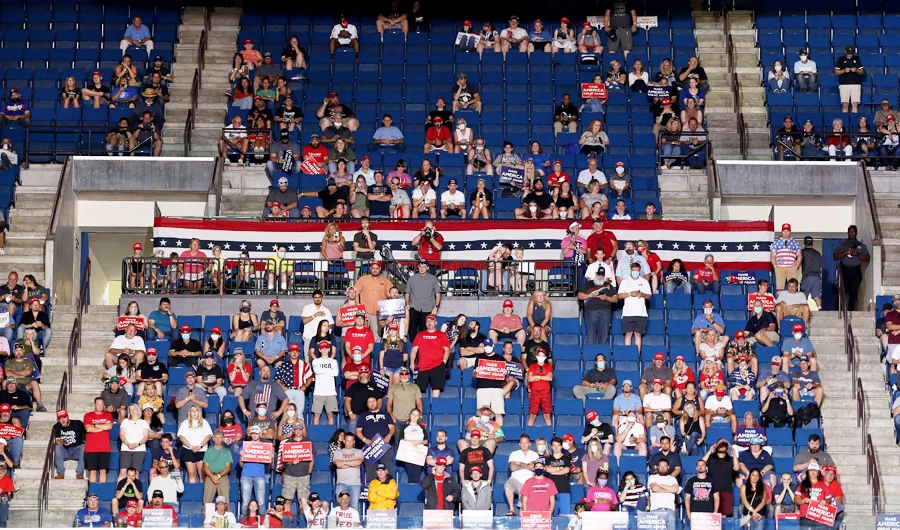 Trump comeback rally features empty seats, staff infections