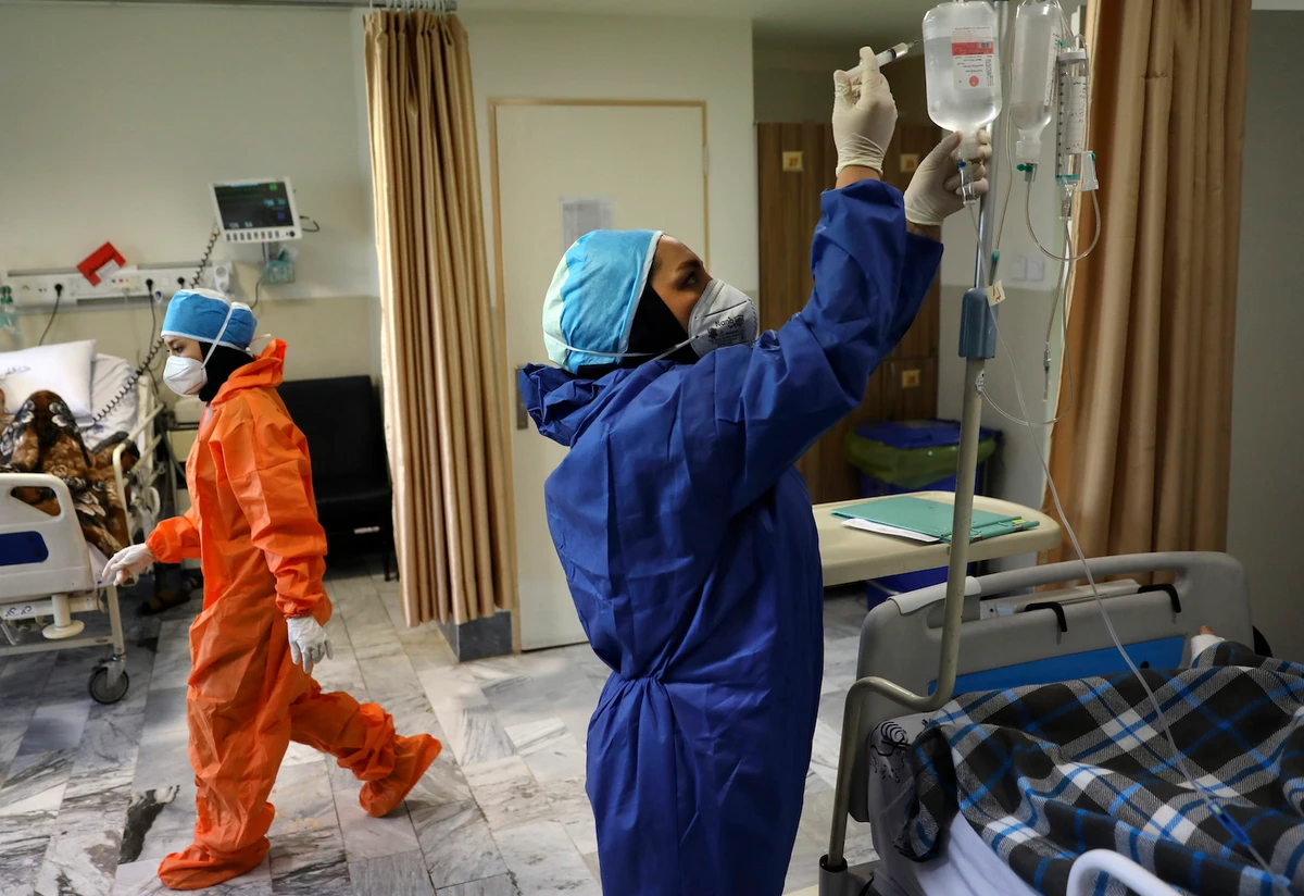 Nurses tend to COVID-19 patients at the Shohadaye Tajrish Hospital in Tehran, Iran. (File/AP)
