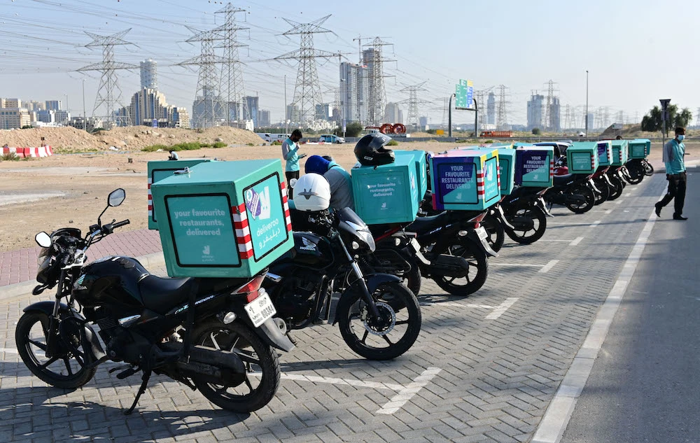 Motorbikes belonging to a delivery company are picture lined up in Dubai, in the United Arab Emirates, on April 16, 2020. (AFP/File Photo)