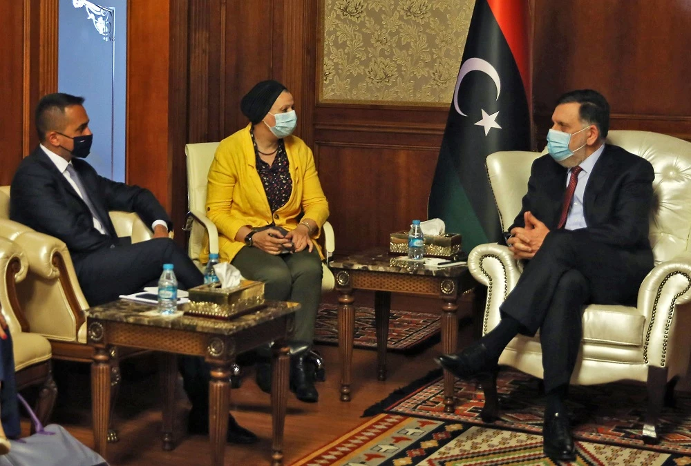 Fayez Al-Sarraj, riight, the head of Tripoli’s Government of National Accord, meets with Italy’s Foreign Minister Luigi Di Maio in Tripoli on June 24, 2020. (AFP)