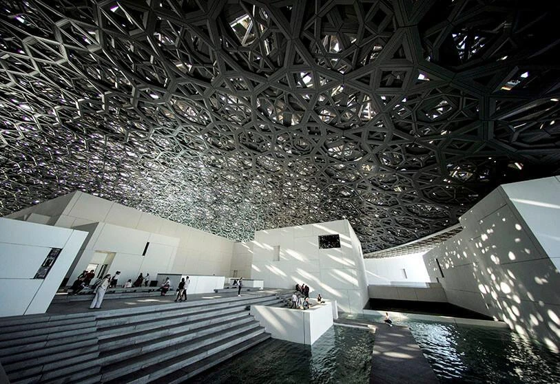 Visitors look at the dome hall design of the Louvre Abu Dhabi Museum in Abu Dhabi, United Arab Emirates, December 25, 2018. (Reuters)