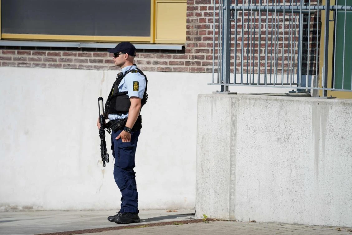A policeman stands on June 26, 2020 in front of the court in Roskilde, Denmark, that is expected to deliver a verdict on whether a Norwegian-Iranian man is guilty of assisting an Iranian intelligence service in preparing an assault on an exile Iranian. (AFP)