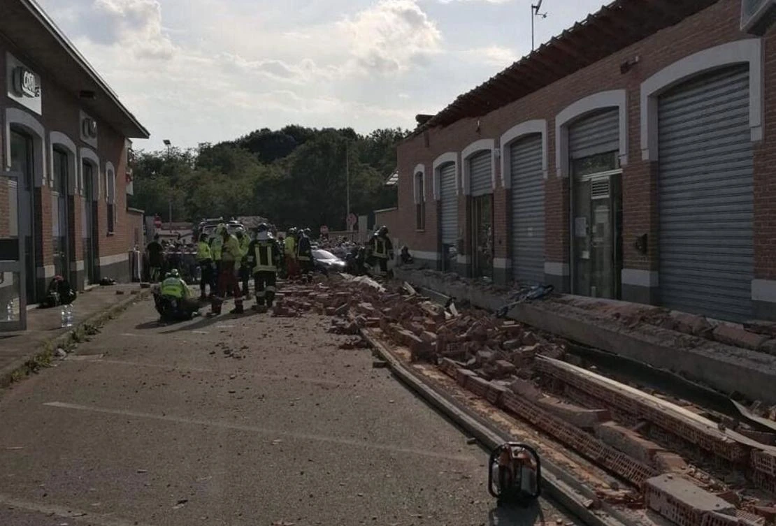 An Urban Search And Rescue team work at the site of a building collapse in Albizzate, near Varese, northern Italy, that killed a woman and her two children. (AFP)