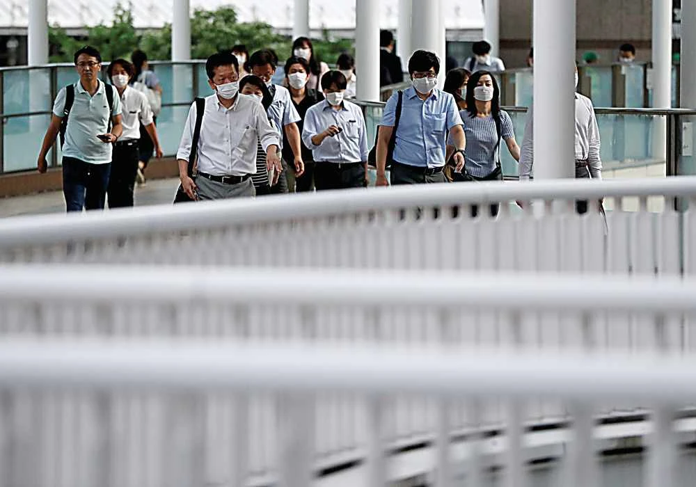 The new plastic “c-mask”, which will be available in September, will fit over standard face masks and will be able to transcribe speech into text messages, make calls, or amplify the mask wearer’s voice. (Reuters)