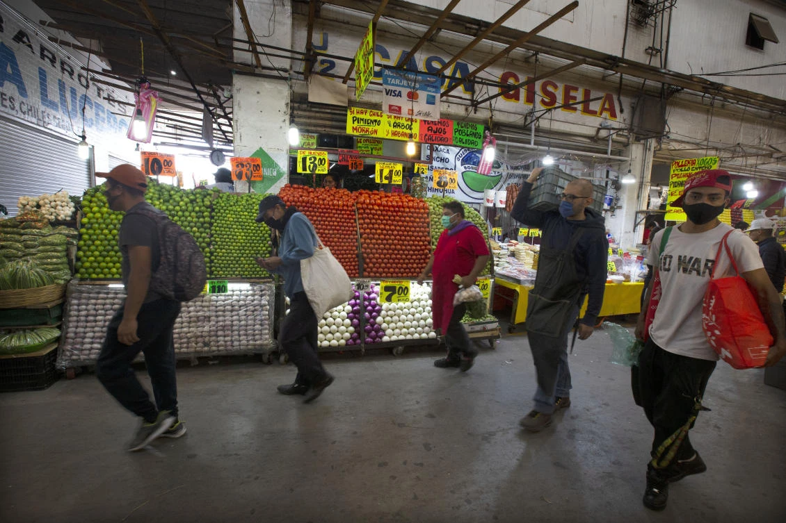 People shop at at the Central de Abasto wholesale food market in Mexico City, Friday, June 26, 2020. (AP)
