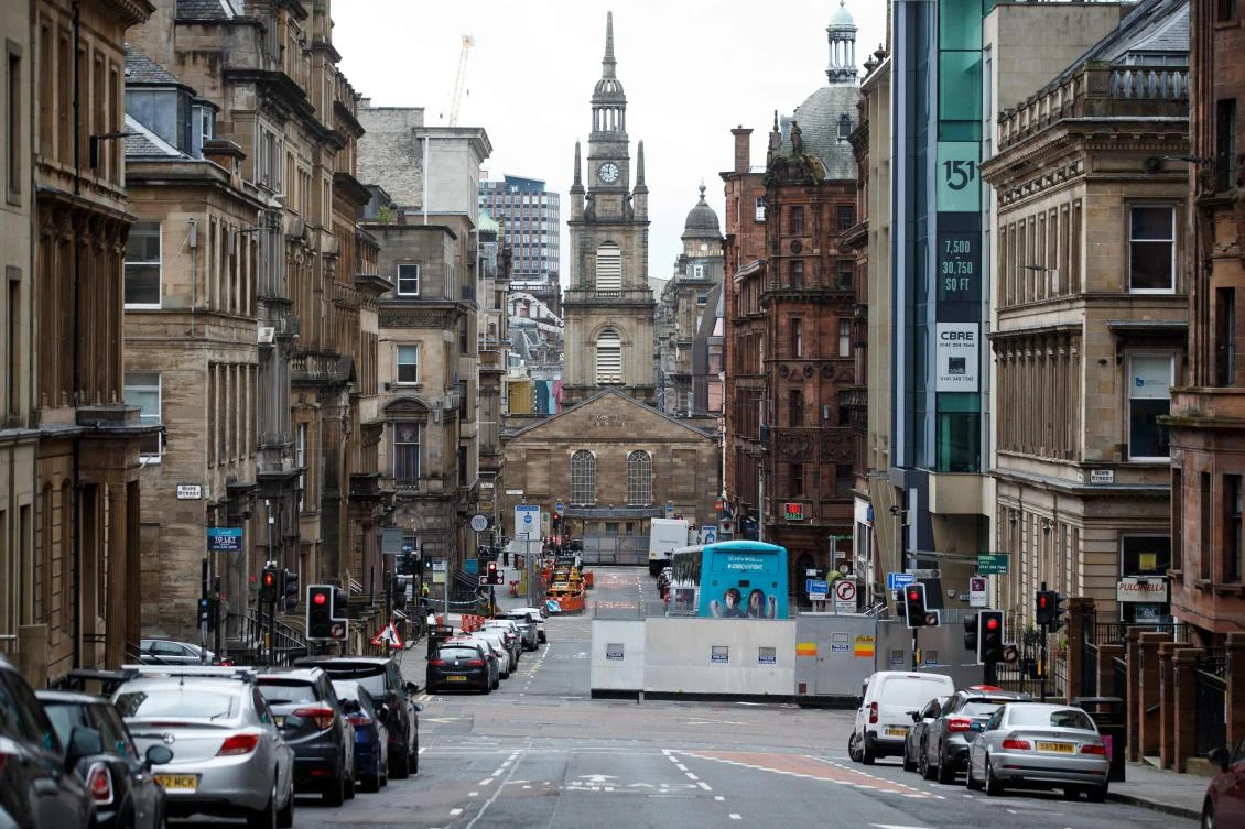Roads remain closed and a police cordon in place in central Glasgow on June 27, 2020 following a stabbing incident at the Park Inn hotel the previous day. (AFP)