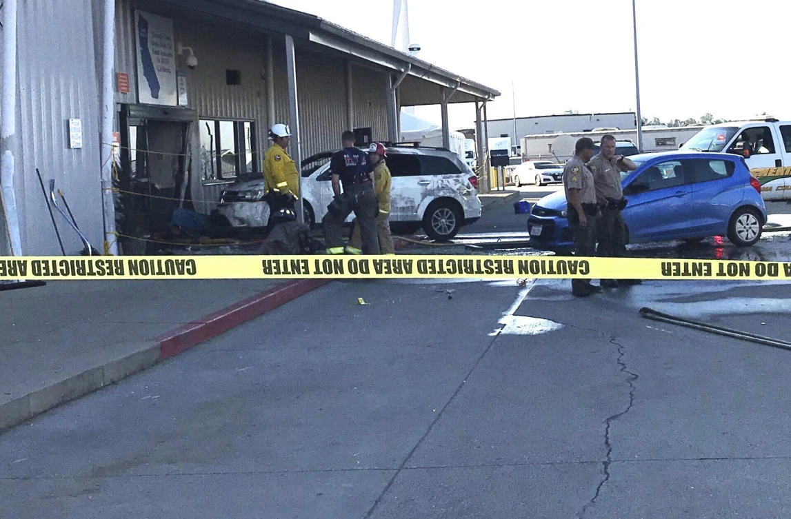 Deputies and firefighters stand outside the Red Bluff Walmart distribution center after a man reportedly opened fire there and rammed his vehicle into the building, Saturday, June 27, 2020, in Red Bluff, Calif. (AP)